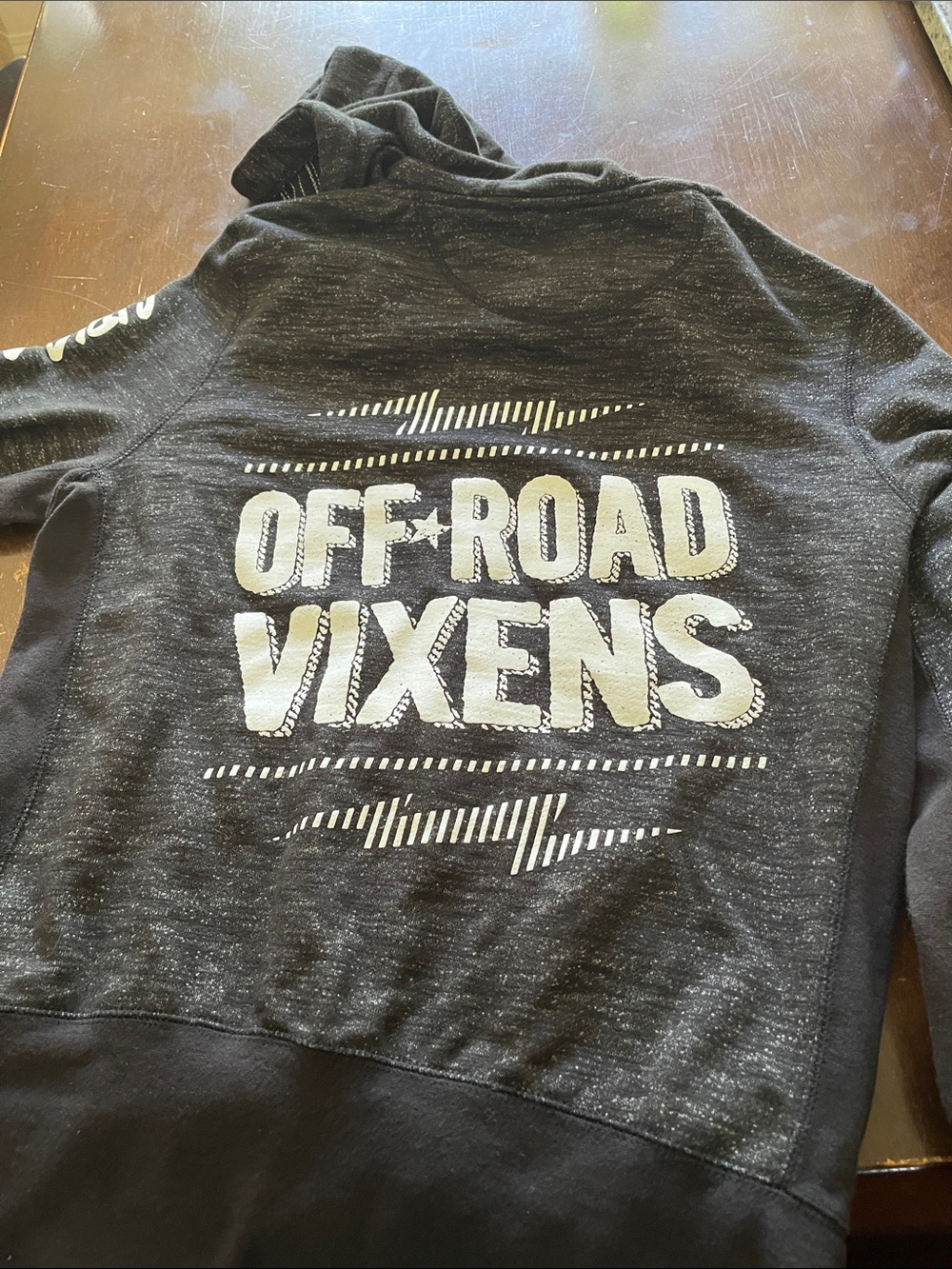 Off Road Vixens
Woman’s Black Heather Full-Zip Hoodie with Crest Patch